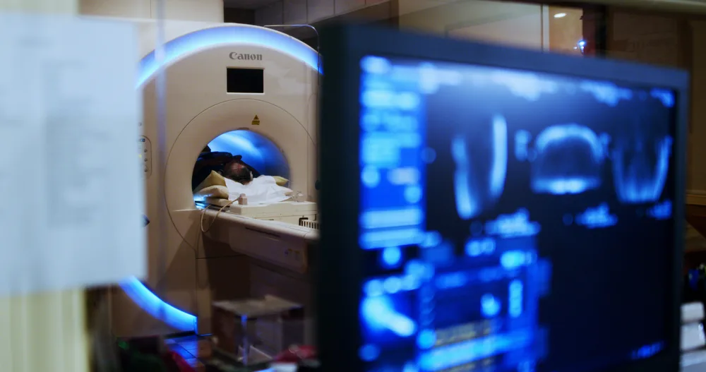 A patient in the Canon Vantage Orion 1.5T at NVRA, seen from the control room